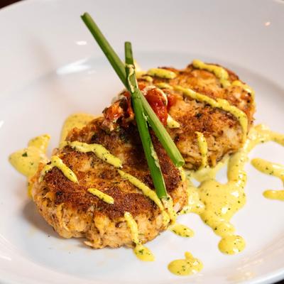 Jumbo Lump Crab Cakes, with yellow pepper aioli, and lemon tomato confit.