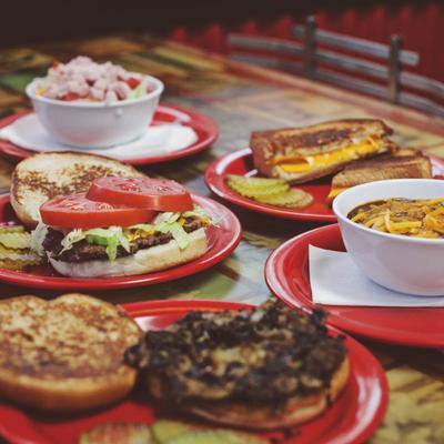 Multiple food plates spread on the table