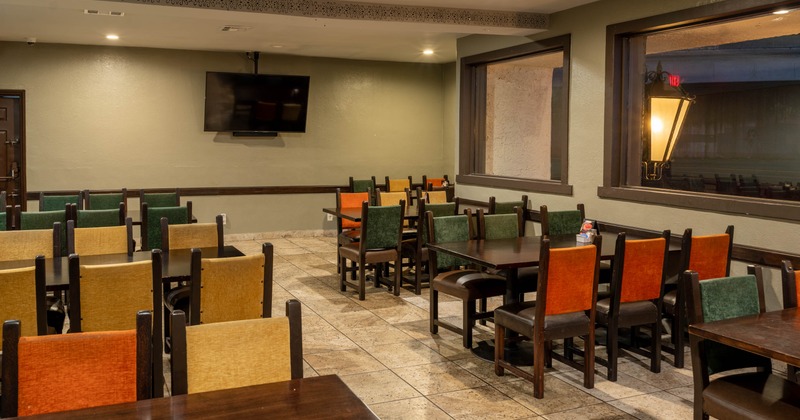 Restaurant dining area with wooden tables and chairs