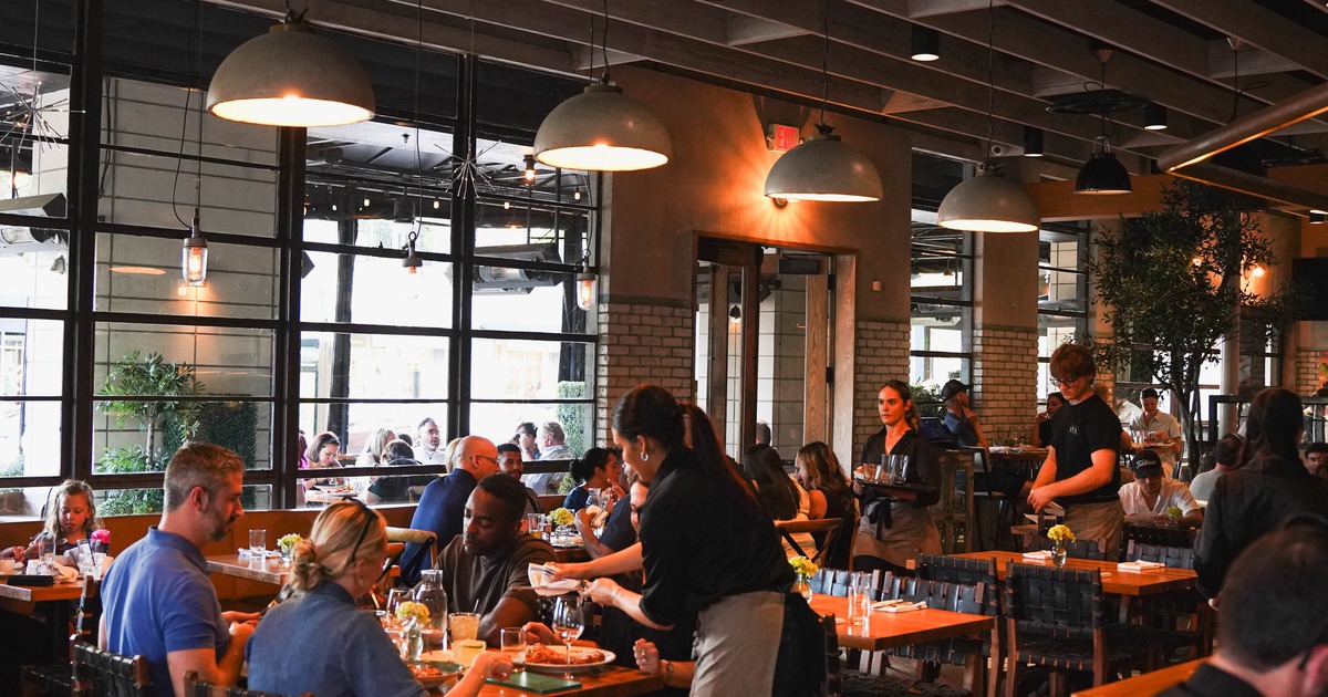 Interior, main dining area filled with guests