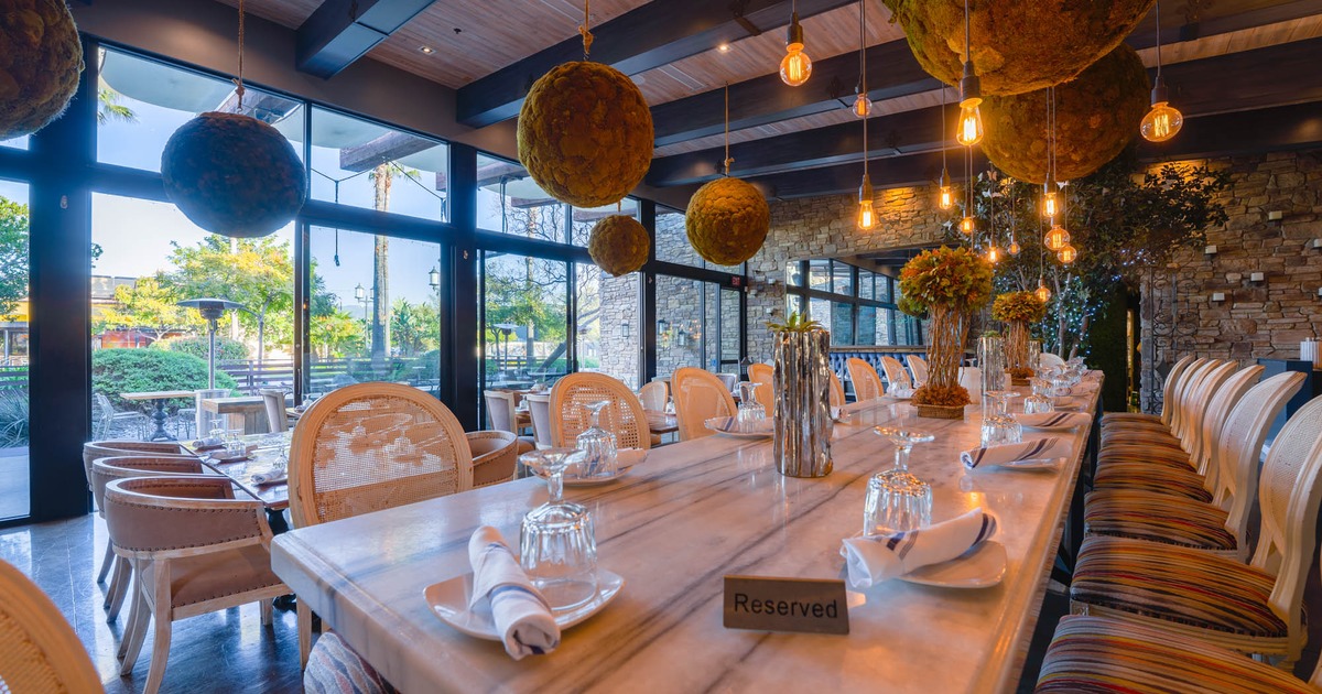 Inside, seating area with tables and chairs, ceiling decoration