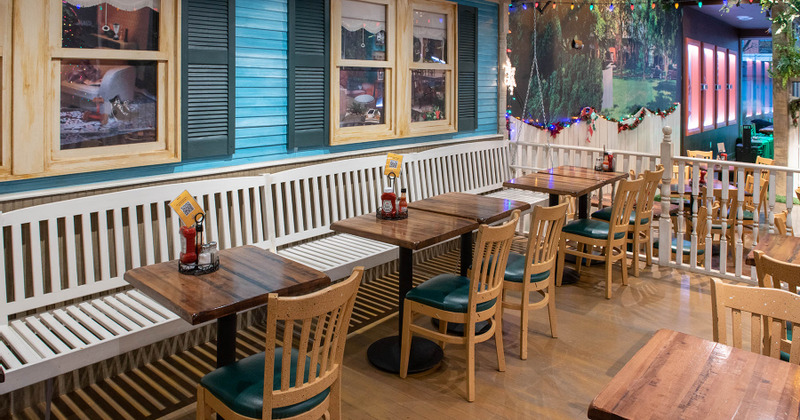 Interior, tables for two ready for guests