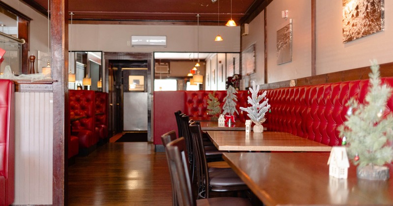 Bar area on the left, restaurant booths on the right