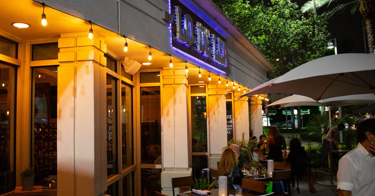 Inside, set dining tables