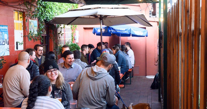 Outdoor seating area, customers having drinks