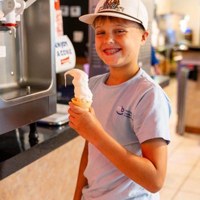 A person holding ice cream.