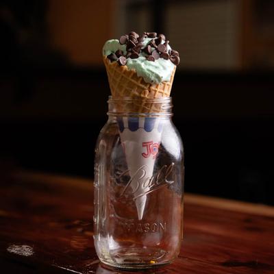 Mint chocolate chip ice cream cone.