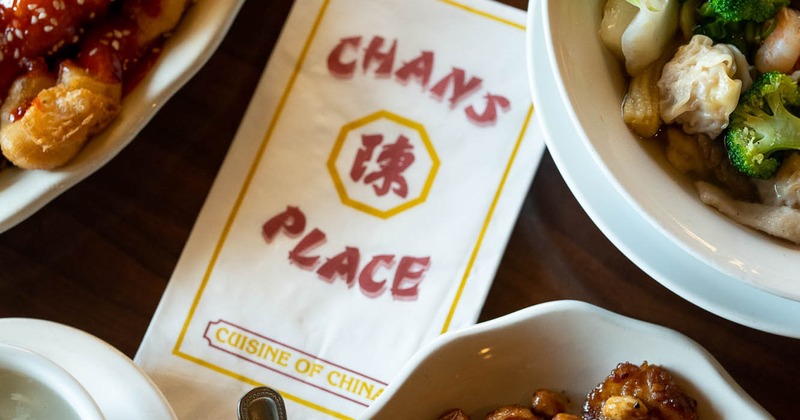 Assorted dishes and menu on a table, top view