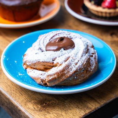 Bombolini dessert on a blue plate.
