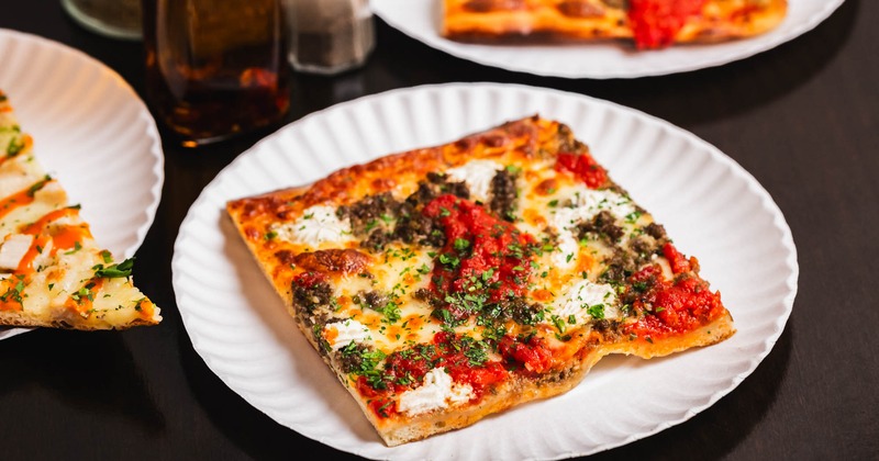 Pizza slices served on plates