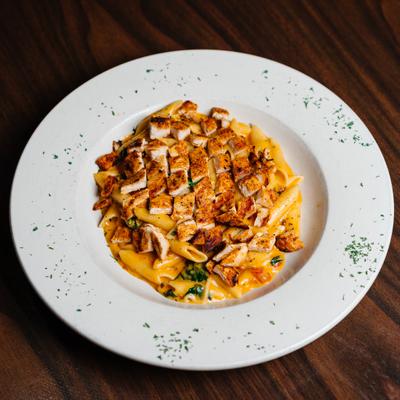 Ziti in creamy pink sauce, with grilled chicken.