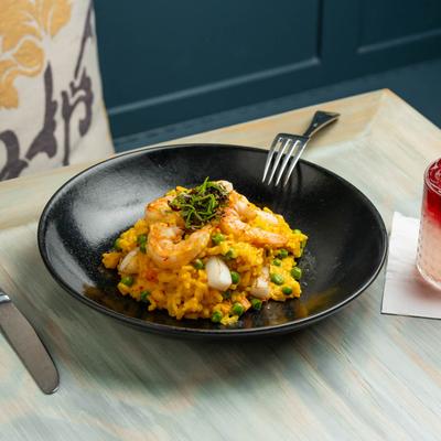 Risotto alla Veneziana  Carnaroli rice with Saffron, shrimp & Calamari.