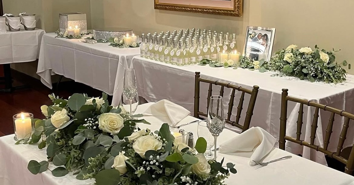 Decorated sweetheart table and a gift table set up for a wedding reception