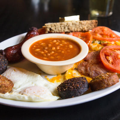 Two eggs, Irish sausage, tomatoes, black and white pudding, baked beans and cheese potatoes