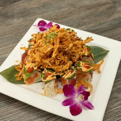 Salmon, shrimp tempura and tuna rolls, nestled around tempura veggies.