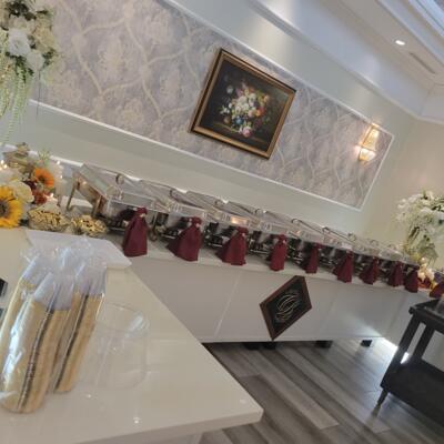 Buffet table with catering trays.