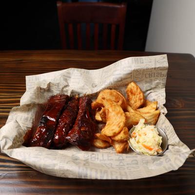 3 Bbq ribs and tornado Fries with coleslaw.