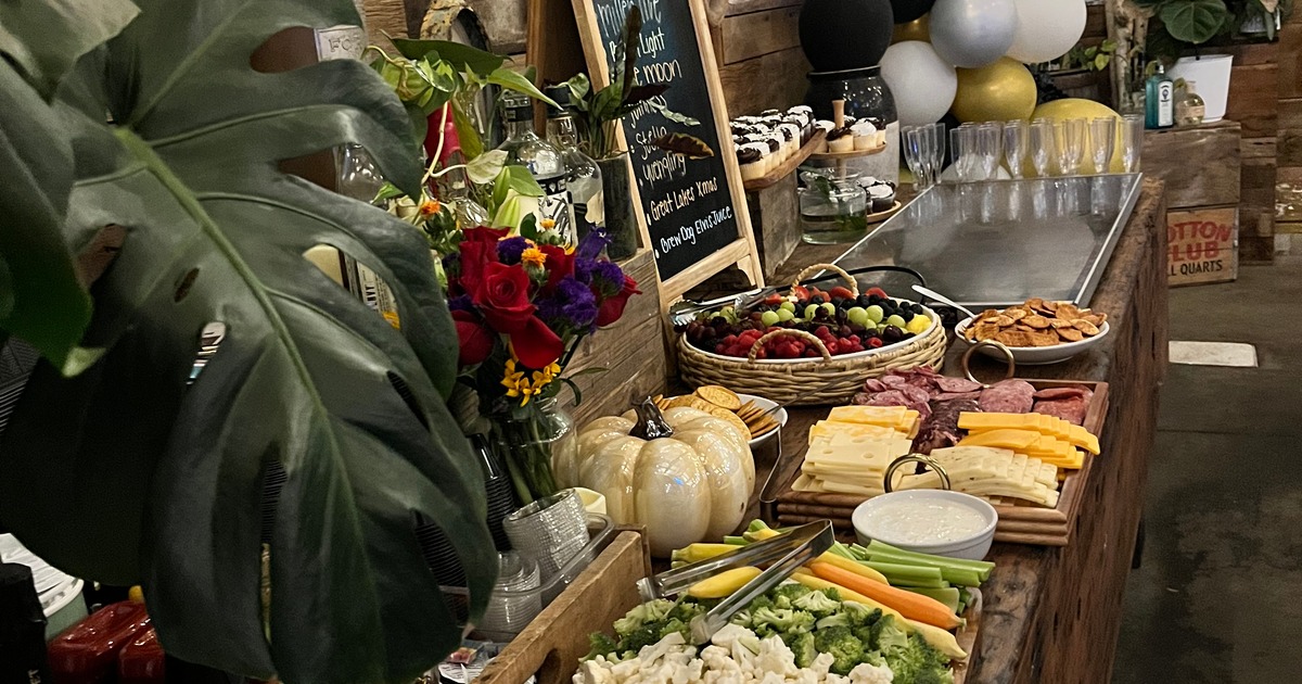 A rustic-themed buffet or grazing table set up for a special event or party