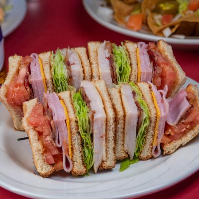 Club sandwich, cut into quarters and held together with toothpicks.