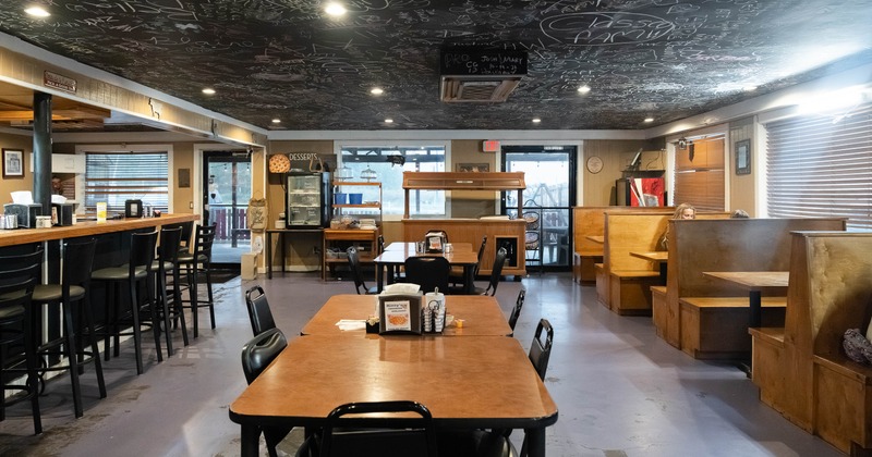 Interior, spacious dining area with tables and chairs