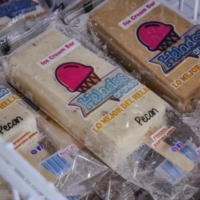 Ice cream bars in a freezer.