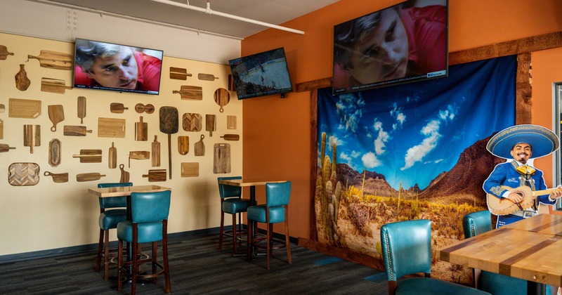 Interior, tables for two and chairs