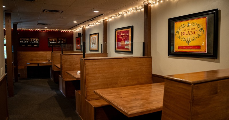 Interior dining area with lined-up wooden dining booths