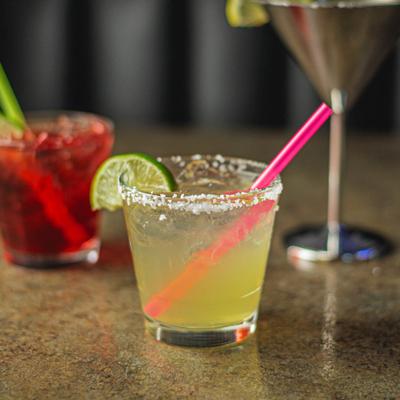 Margarita on a counter with other cocktails in the background.