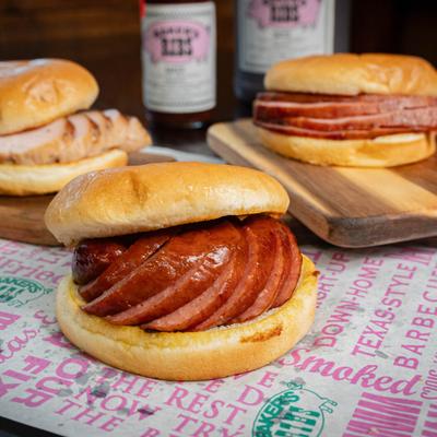 A variety of smoked BBQ sandwiches on a bun.
