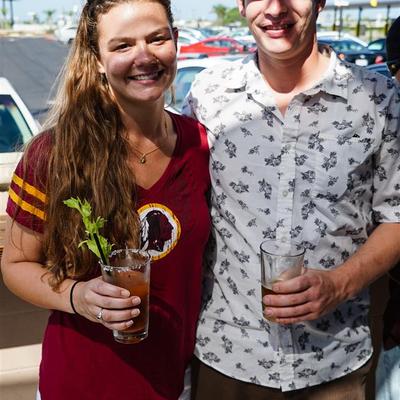 A young smiling couple posing for a photo