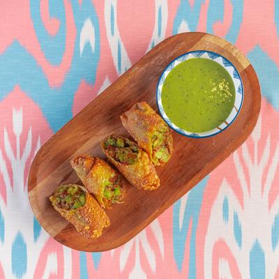 Fried rolls, with avocado, sun dried tomatoes, red onion, and avocado dressing on the side.