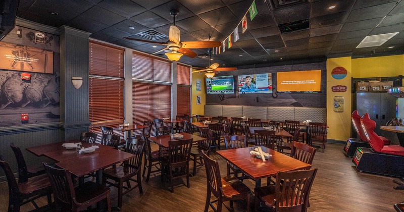 Dining area with TVs on the wall