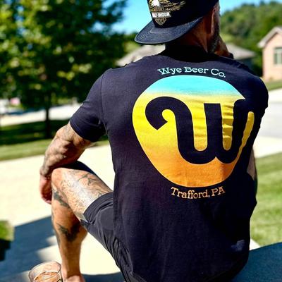 A person wearing a Wye Beer Co. t shirt.