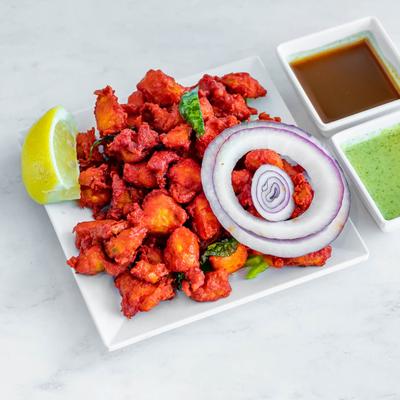 Boneless chicken, seasoned with herbs and spices.