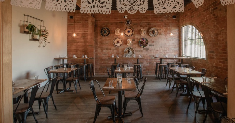 Interior, dining area with decorated brick wall