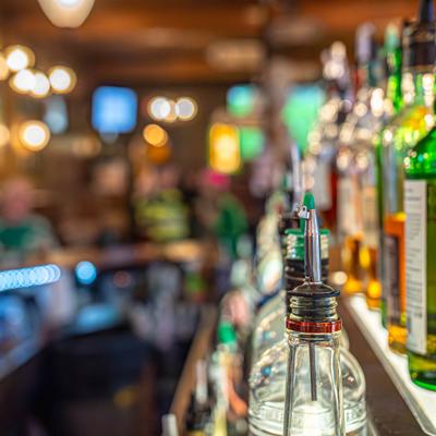 Fully stocked bar shelves, close-up.