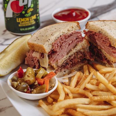 Morry's Sky High Triple Decker sandwich with fries and peppers.