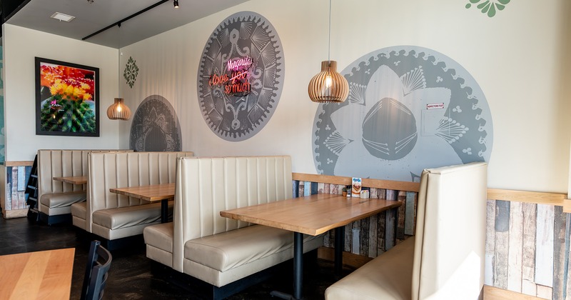 Upholstered booths lined up by the wall