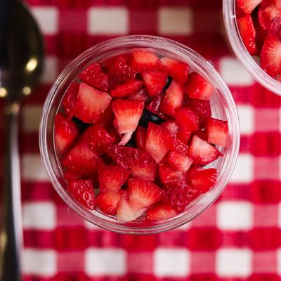 Yoghurt parfait topped with berries, top view.