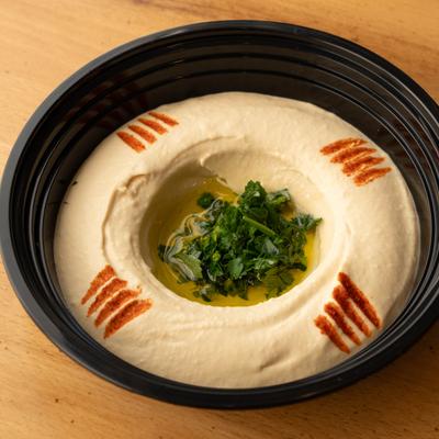 Hummus with herbs in the center.