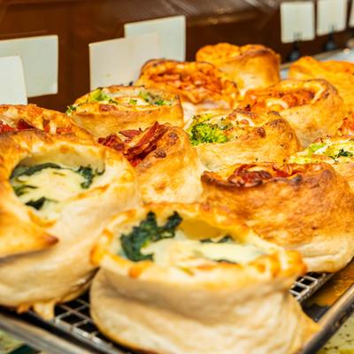 Assorted pinwheel rolls with spinach, broccoli, and cheese.