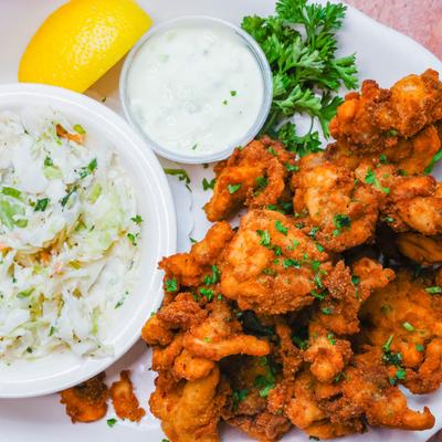 Fried Whole Belly Top Neck Clams served with coleslaw, dressing and lemon.