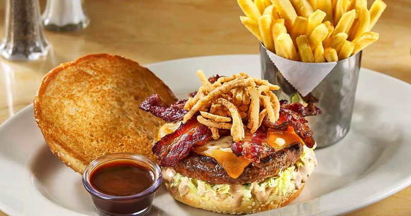 Burger with bacon, fries and dip