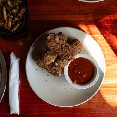 Mozzarella sticks with marinara sauce.