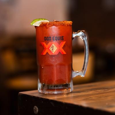 Michelada served in a heavy glass mug.