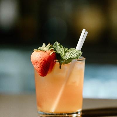 Pineapple Cobbler mocktail garnished with a strawberry and mint.