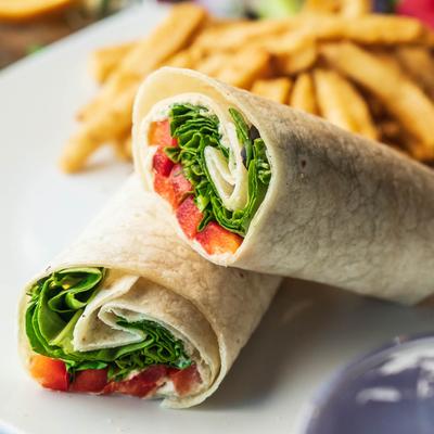 Mediterranean hummus wrap served with fries