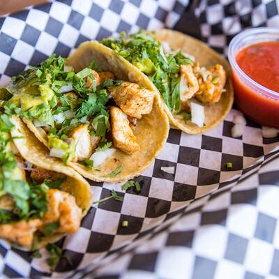 3 grilled pollo/chicken street tacos  with onions and cilantro garnish, housemade salsa on the side