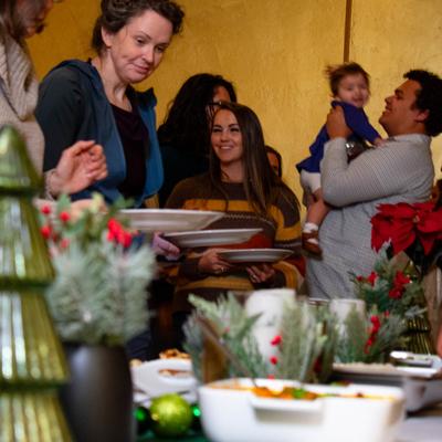 Guests holding plates.