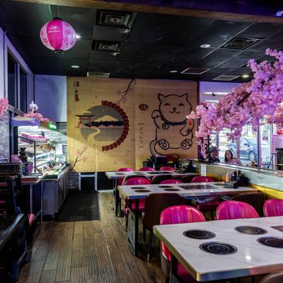 Interior, built in hot pot and BBQ tables, cherry blossom decorations, artwork.